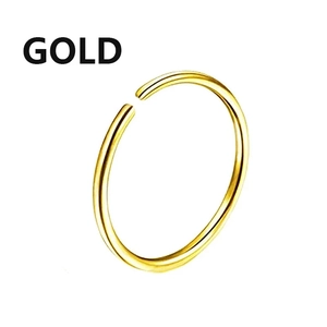 Close-up of a classic polished gold stainless steel nose ring with a minimalist open design