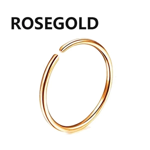 Detailed view of polished rose gold surgical steel circular nose ring jewelry piece