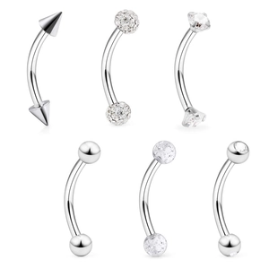 Detail of 6-piece stainless steel eyebrow piercings with zircon and crystal studs set