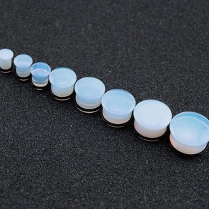 Opalite ear gauges plugs with black rubber O-rings in various sizes for ear stretching