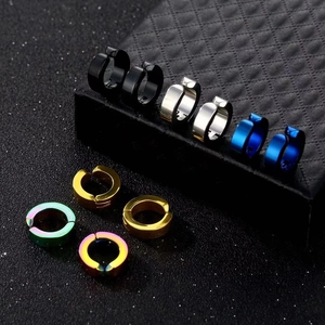 Minimalist stainless steel clip-on earrings in various colors on a luxury jewelry box