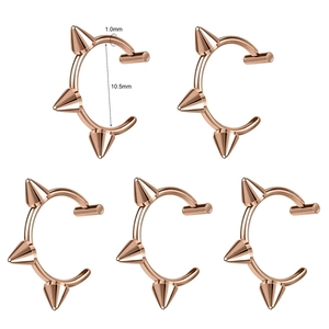 Detailed view of 1.0mm rose gold spike lip rings with 10.5mm inner diameter