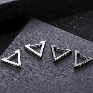 Detail view of 925 sterling silver triangle hoop earrings in silver and gun black metal