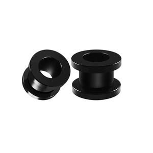 Macro view of black stainless steel ear tunnels with double flared pulley design