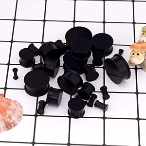 Detailed collection of black silicone ear gauges and stretchers in various sizes