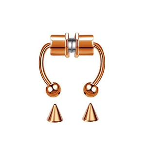 Detail view of rose gold magnetic horseshoe nose ring with sphere and cone tips