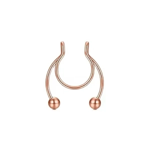 Macro shot of rose gold magnetic septum nose ring with double U-shape and smooth round beads