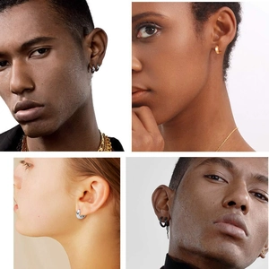 Gros plan sur des boucles d'oreilles en acier inoxydable avec pendentifs à pointe