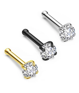 Detailed view of three 4-prong zircon nose studs in gold, black, and silver steel finishes