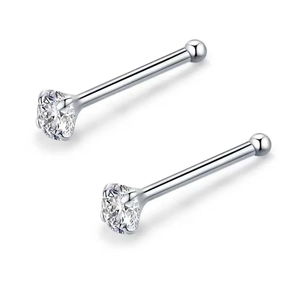 Macro shot of 4-prong set clear zircon studs in polished stainless steel for nose or ears