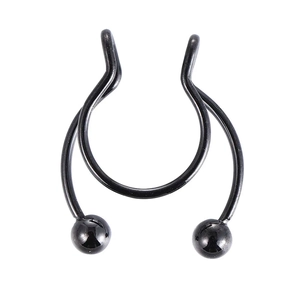 Macro shot of horseshoe-shaped black stainless steel septum ring with polished ball ends