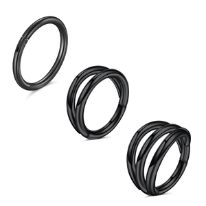 Detailed view of black stainless steel clicker rings in single, double, and triple hoop designs