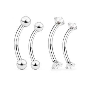 Detail view of 4-piece stainless steel curved barbells with ball and CZ stone ends