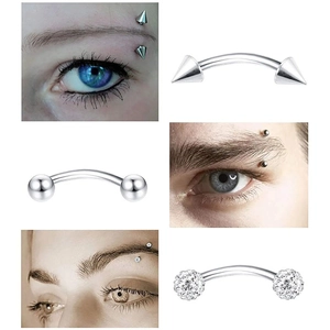 Detail of curved stainless steel eyebrow rings with spike, ball, and zircon ends