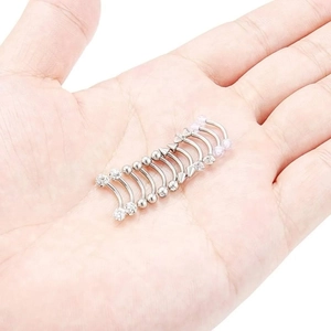 Set of 9 stainless steel curved eyebrow rings with cubic zirconia and spiked ends