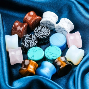 Polished natural stone ear plugs set including turquoise and opal on blue silk