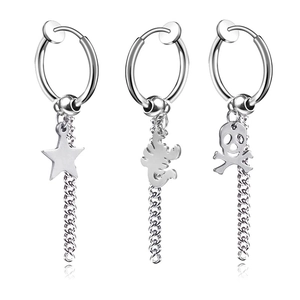 Detail of gothic stainless steel hoop earrings featuring star, scorpion, and skull charms