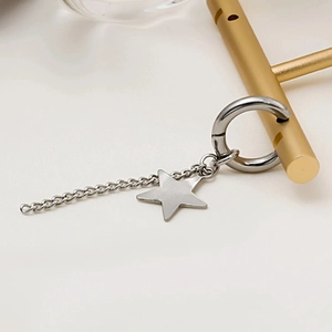 Silver stainless steel earring hoop with chain and star pendant in minimalist style