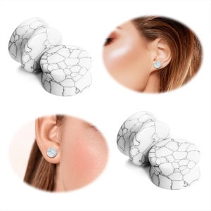 Close-up of white turquoise ear gauges featuring natural grey marble texture on model