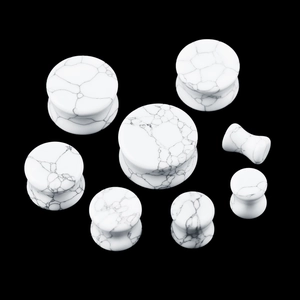 Set of double flared white howlite stone ear gauges with marble texture in various sizes