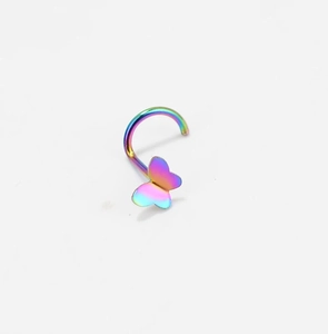 Macro detail of rainbow butterfly nose stud featuring a dual-layer 3D metal wing design