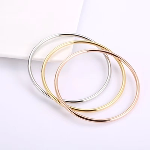 Set of three minimalist 3mm titanium steel bangle bracelets in silver, gold, and rose gold