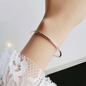 Minimalist 3mm titanium steel bangle for women in polished 18k rose gold finish