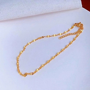 Close-up of elegant 18k gold plated titanium chain with heart links and lobster clasp