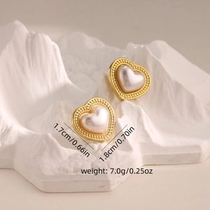 Detailed view of heart-shaped gold-tone pearl earrings with dimensions 1.7x1.8cm
