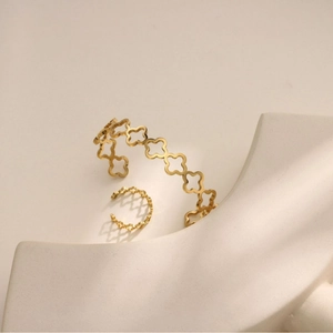 Golden stainless steel C-shaped cuff bracelet and hollow clover ring jewelry set