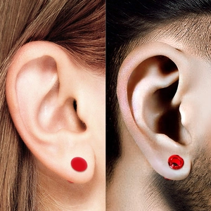 Red acrylic ear gauges and plugs set with smooth ruby-red finish for ear stretching