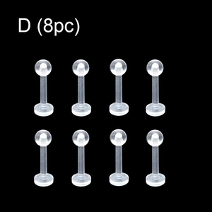 Set of 8 clear acrylic labret studs with flat back and ball top on black background