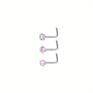 Detailansicht von drei L-förmigen Nasensteinen mit rosa Zirkonia in Stern- und Herzform