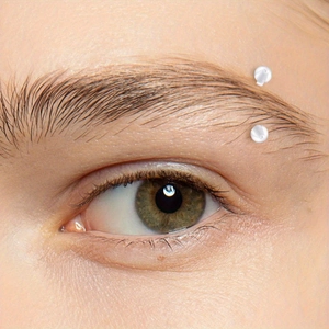 Close-up of a silver-tone eyebrow piercing jewelry showing realistic wear fit and size