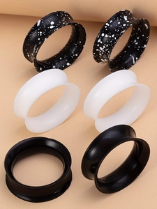 Sechsteiliges Set aus Silikon-Ohrplugs mit doppeltem Flare in Schwarz, Weiß und Farbspritzern