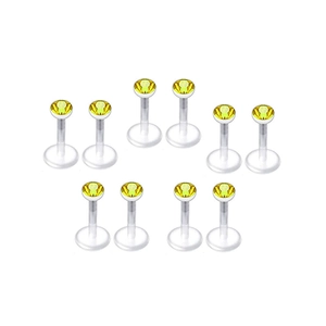 Detail von 10 Acryl-Lippenpiercings mit transparenten Stäben und gelben Zirkonia-Steinen