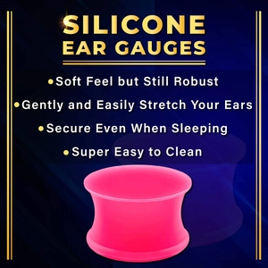 Detail view of pink silicone double flare ear gauges showing flexible soft material