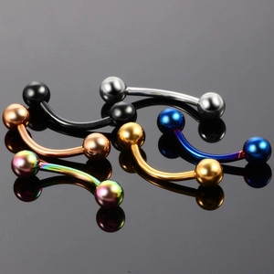 Macro display of curved barbell piercing studs in various metallic finishes and colors