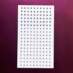 Silver self-adhesive nose and lip stud stickers with metallic finish on rectangular card
