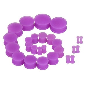 Detailed set of purple silicone ear gauges and tunnels in various sizes on white backdrop