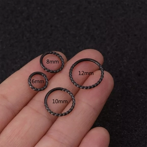 Set of four black twisted stainless steel nose rings in sizes 6mm, 8mm, 10mm and 12mm