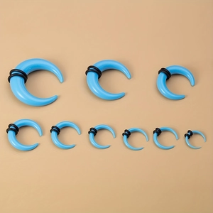 Detailed set of 9 sky blue acrylic horn ear tapers with black O-rings in various sizes