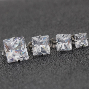 Set of four square-cut cubic zirconia stud earrings in silver claw settings