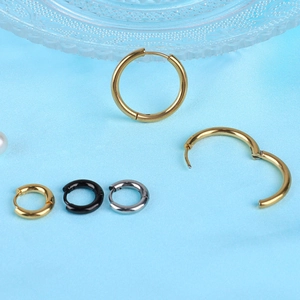 Polished stainless steel hoop earrings set in gold, black, and silver in various sizes