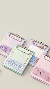 Detail of A6 pocket clipboards with colorful pastel notepad pages and metal clips