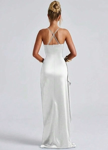 Detail of cross back straps and pleated texture on a silver satin maxi dress