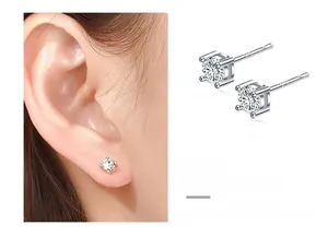 Detailed view of square four-prong silver stud earrings featuring brilliant clear stones
