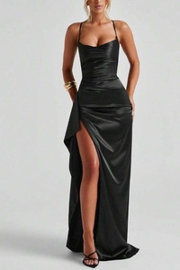 Detail of elegant black satin long dress featuring high side slit and smooth silky texture