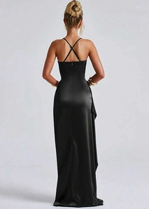 Detail of elegant black satin maxi dress featuring a cross-back strap design for formal events