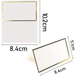 Detailed view of white place card with gold border showing folded and open dimensions